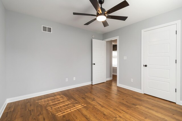 131 Patriot Trl, Berea, KY 40403 - unfurnished bedroom with baseboards, wood finished floors, and ceiling fan