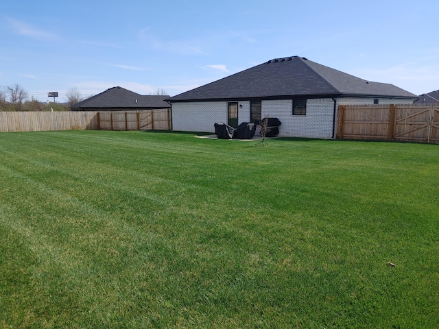 131 Patriot Trl, Berea, KY 40403 - back of property featuring a shingled roof and brick siding