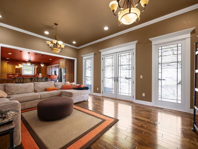 100 Mountain Enterprise Dr, Inez, KY 41224 - living area with french doors, baseboards, ornamental molding, dark wood-type flooring, and an inviting chandelier