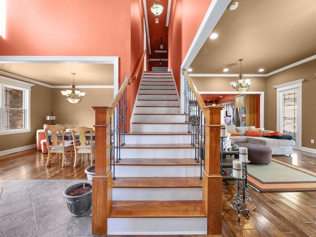 100 Mountain Enterprise Dr, Inez, KY 41224 - stairway featuring baseboards, a notable chandelier, and hardwood / wood-style flooring