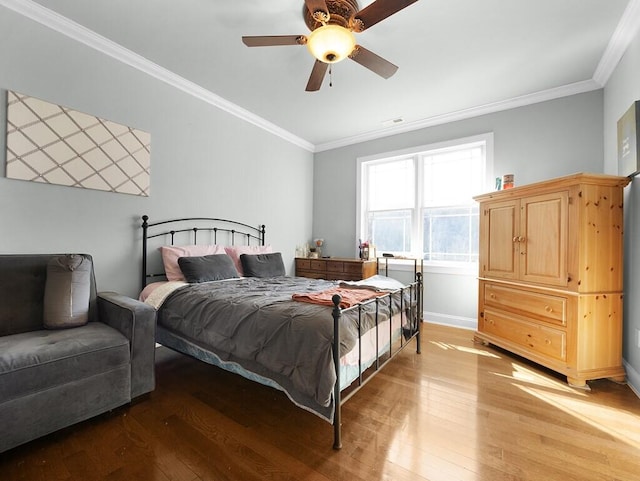 100 Mountain Enterprise Dr, Inez, KY 41224 - bedroom with crown molding, light wood-style flooring, baseboards, visible vents, and ceiling fan