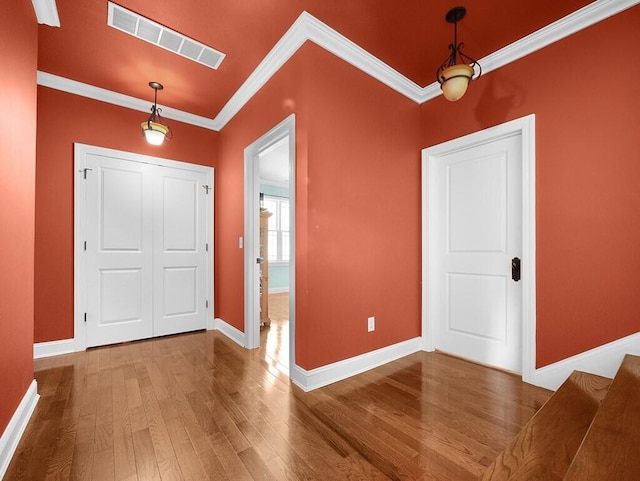 100 Mountain Enterprise Dr, Inez, KY 41224 - entryway featuring baseboards, visible vents, crown molding, and wood finished floors