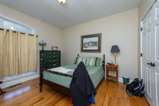 790 Thatchers Mill Rd, Paris, KY 40361 - bedroom with wood finished floors, baseboards, and visible vents