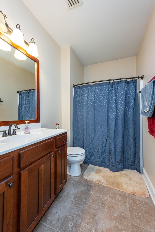 790 Thatchers Mill Rd, Paris, KY 40361 - bathroom with visible vents, toilet, stone finish floor, and vanity