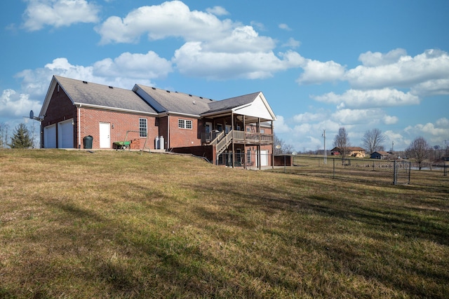 790 Thatchers Mill Rd, Paris, KY 40361 - rear view of property with stairway, fence, brick siding, a garage, and a lawn