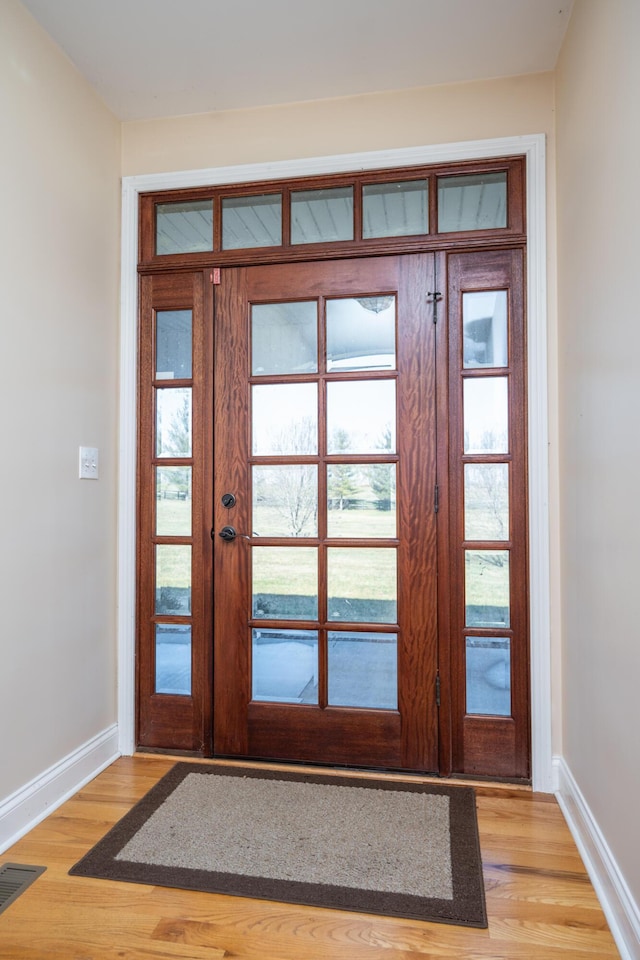 790 Thatchers Mill Rd, Paris, KY 40361 - foyer with french doors, baseboards, light wood-style floors, and visible vents
