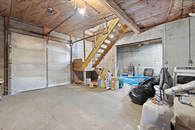 garage with concrete block wall