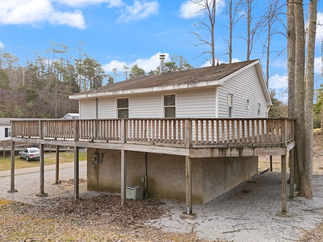 back of house featuring a deck