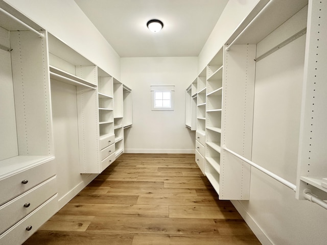 spacious closet with light wood-style floors