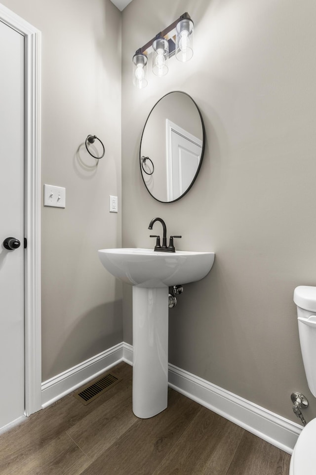 236 Candy Apple Ln, Richmond, KY 40475 - bathroom featuring baseboards, wood finished floors, visible vents, and toilet