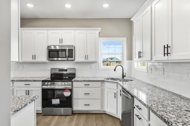 236 Candy Apple Ln, Richmond, KY 40475 - kitchen featuring recessed lighting, a sink, white cabinetry, and appliances with stainless steel finishes