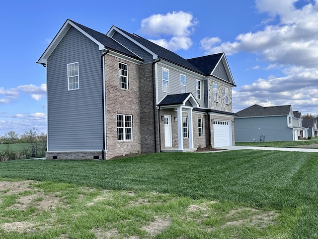 236 Candy Apple Ln, Richmond, KY 40475 - view of front of house featuring an attached garage, brick siding, driveway, and a front lawn