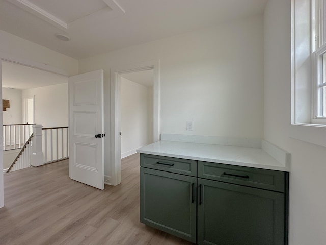 interior space with green cabinetry and light wood-type flooring