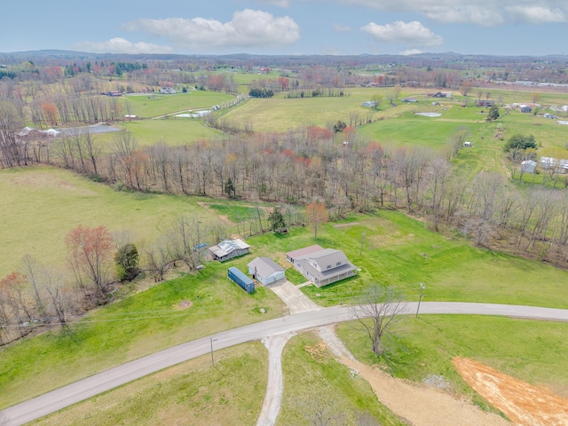 birds eye view of property featuring a rural view
