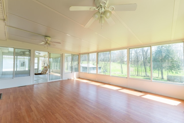 unfurnished sunroom featuring ceiling fan and visible vents