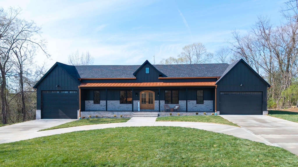 1044 Morris Dr, Richmond, KY 40475 - modern inspired farmhouse featuring board and batten siding, concrete driveway, and an attached garage