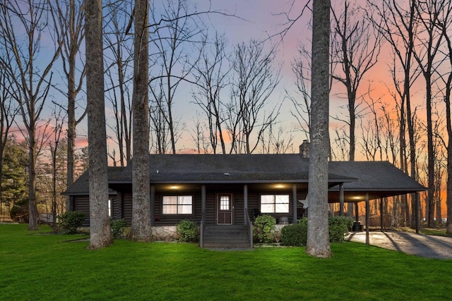 675 Indian Cave Subdivision Rd, Monticello, KY 42633 - view of front of property featuring a front yard, concrete driveway, a carport, and a shingled roof