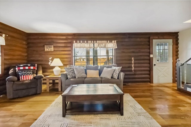 675 Indian Cave Subdivision Rd, Monticello, KY 42633 - living area with log walls, wood finished floors, and plenty of natural light