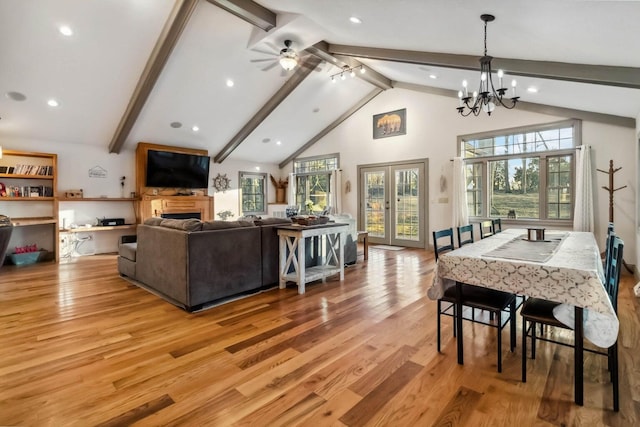 675 Indian Cave Subdivision Rd, Monticello, KY 42633 - dining space with beamed ceiling, light wood-style floors, a fireplace, high vaulted ceiling, and a chandelier