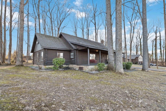 675 Indian Cave Subdivision Rd, Monticello, KY 42633 - view of front facade featuring log exterior, a porch, and roof with shingles