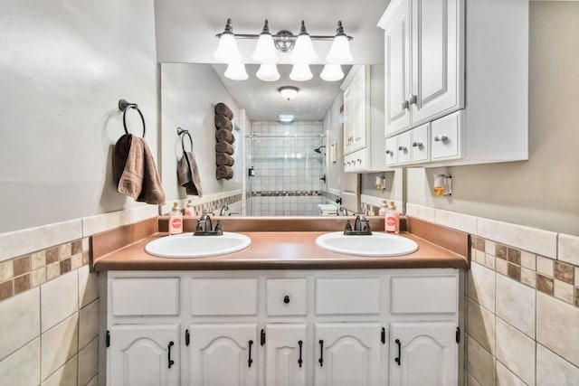 675 Indian Cave Subdivision Rd, Monticello, KY 42633 - bathroom with tile walls, a stall shower, and double vanity