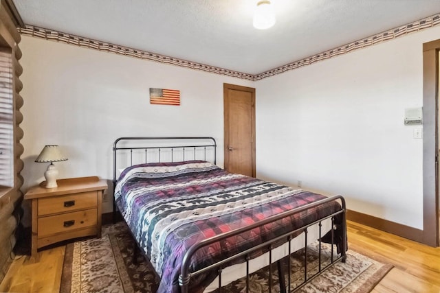 675 Indian Cave Subdivision Rd, Monticello, KY 42633 - bedroom featuring wood finished floors and baseboards
