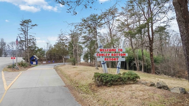 675 Indian Cave Subdivision Rd, Monticello, KY 42633 - view of asphalt road featuring traffic signs
