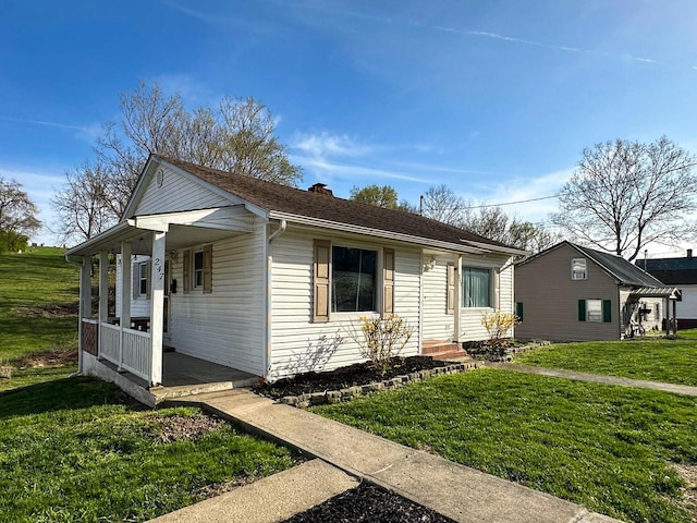 247 Mt Sterling Ave, Flemingsburg, KY 41041 - view of front of home with a porch, a front lawn, and a chimney