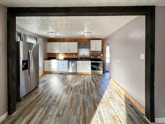 247 Mt Sterling Ave, Flemingsburg, KY 41041 - kitchen with white cabinetry, a sink, dark countertops, and appliances with stainless steel finishes