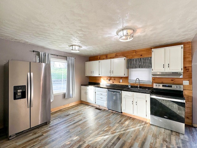 247 Mt Sterling Ave, Flemingsburg, KY 41041 - kitchen with white cabinets, a sink, stainless steel appliances, and dark countertops