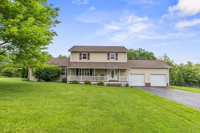 traditional-style home featuring a porch, an attached garage, asphalt driveway, and roof with shingles