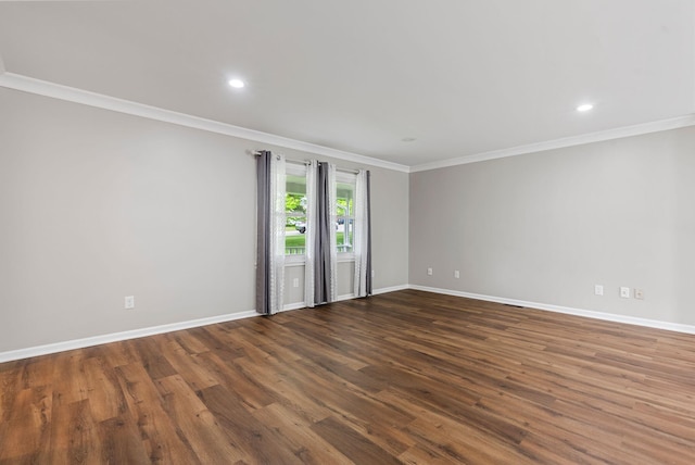 empty room with crown molding, baseboards, wood finished floors, and recessed lighting