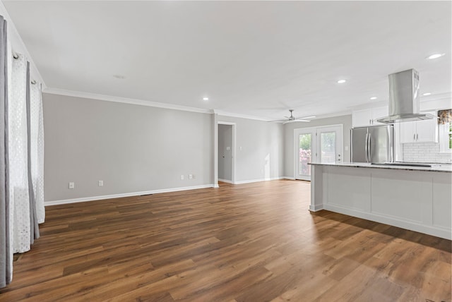unfurnished living room with dark wood-style floors, crown molding, ceiling fan, recessed lighting, and baseboards