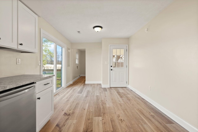 80 Westview Dr, Stanton, KY 40380 - kitchen featuring baseboards, light countertops, white cabinetry, stainless steel dishwasher, and light wood finished floors