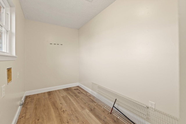 80 Westview Dr, Stanton, KY 40380 - empty room with baseboards, light wood-type flooring, and a textured ceiling