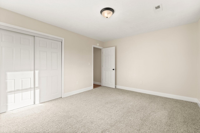 80 Westview Dr, Stanton, KY 40380 - unfurnished bedroom featuring a closet, carpet flooring, baseboards, and visible vents