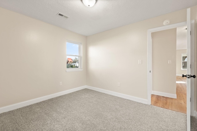 80 Westview Dr, Stanton, KY 40380 - carpeted empty room featuring a textured ceiling, baseboards, and visible vents