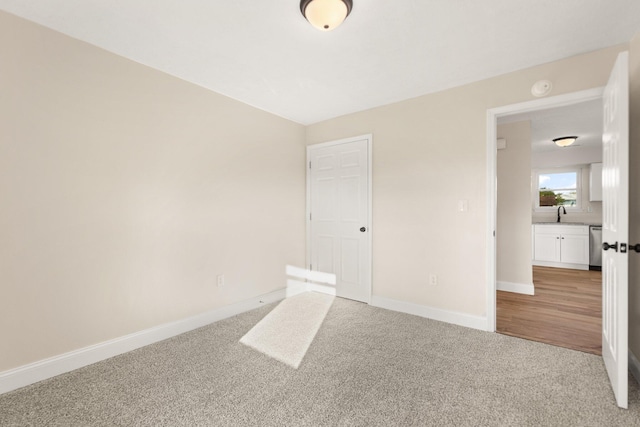 80 Westview Dr, Stanton, KY 40380 - unfurnished bedroom featuring a sink, light colored carpet, and baseboards