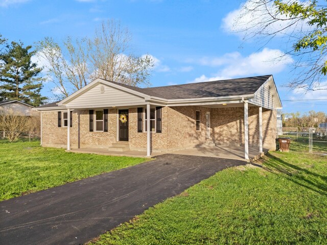 80 Westview Dr, Stanton, KY 40380 - single story home with a carport, driveway, a front lawn, brick siding, and fence