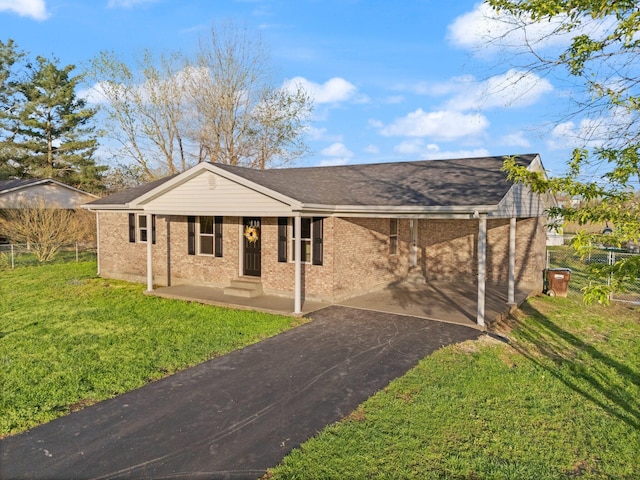 80 Westview Dr, Stanton, KY 40380 - single story home with aphalt driveway, a carport, roof with shingles, a front yard, and brick siding