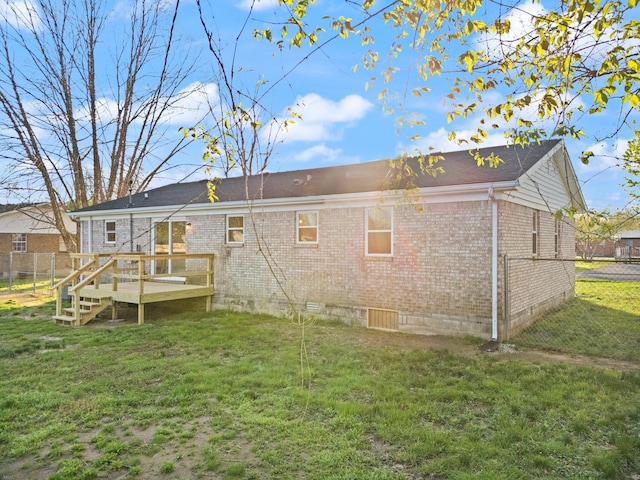80 Westview Dr, Stanton, KY 40380 - rear view of house with brick siding, fence, and a lawn