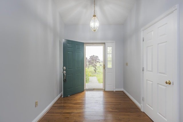 256 Sutton Ln, Lancaster, KY 40444 - entryway featuring a chandelier, dark wood-style flooring, and baseboards
