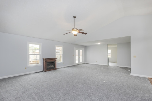 256 Sutton Ln, Lancaster, KY 40444 - unfurnished living room with vaulted ceiling, a ceiling fan, a fireplace, baseboards, and carpet floors
