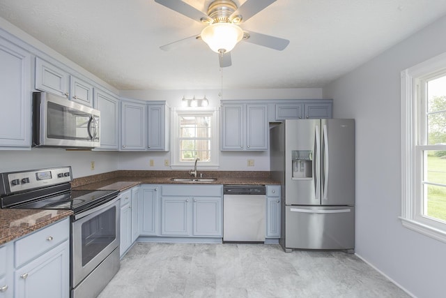 256 Sutton Ln, Lancaster, KY 40444 - kitchen with stainless steel appliances, a sink, healthy amount of natural light, and a ceiling fan