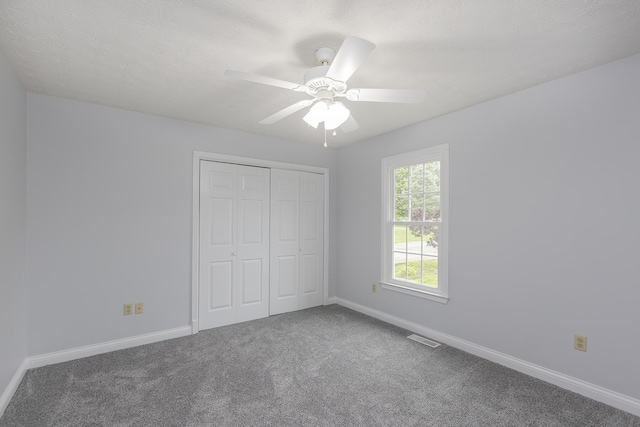 256 Sutton Ln, Lancaster, KY 40444 - unfurnished bedroom with carpet, baseboards, a closet, and ceiling fan