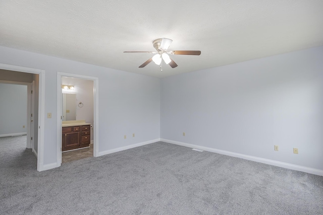 256 Sutton Ln, Lancaster, KY 40444 - unfurnished bedroom with carpet floors, baseboards, a ceiling fan, and ensuite bathroom