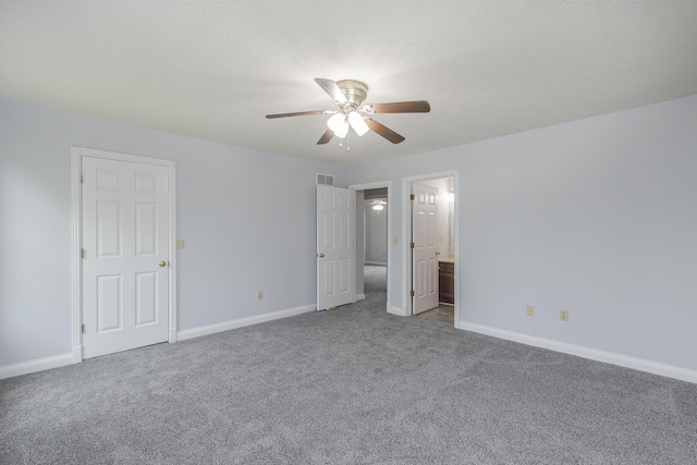 256 Sutton Ln, Lancaster, KY 40444 - unfurnished bedroom featuring carpet flooring, baseboards, connected bathroom, and ceiling fan