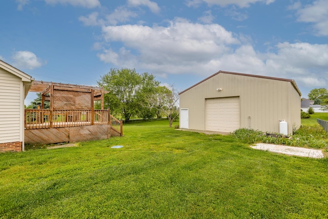 256 Sutton Ln, Lancaster, KY 40444 - view of grassy yard with a wooden deck, a garage, and an outbuilding
