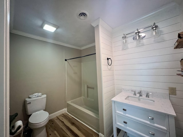 bathroom featuring crown molding, wood finished floors, vanity, toilet, and visible vents