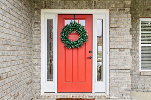 view of exterior entry with stone siding